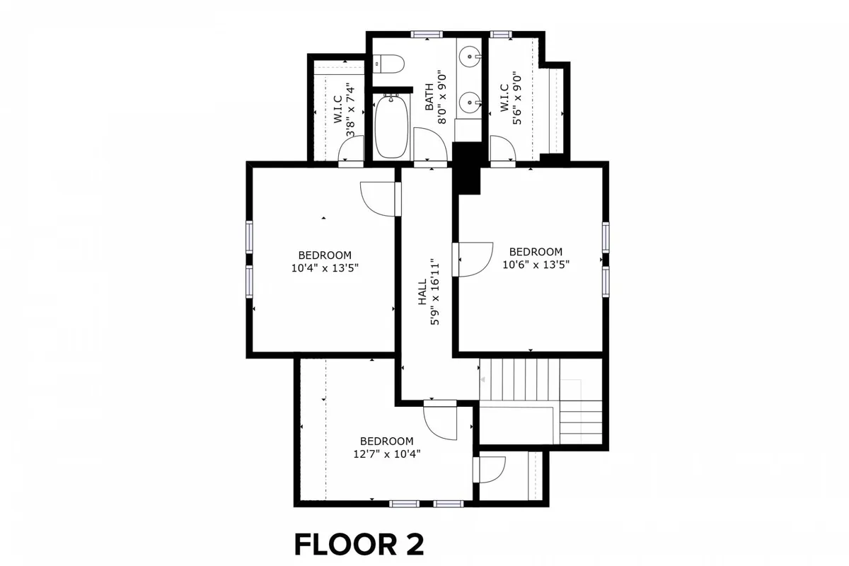 A view down a bright upstairs hallway reveals multiple bedroom doorways and the entrance to a shared bathroom, all styled in a comfortable, family-friendly way. The space is inviting with soft lighting and a sense of privacy between rooms.